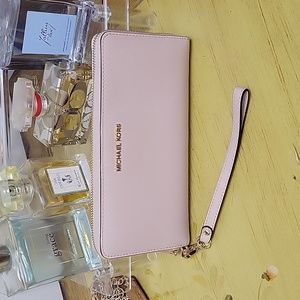 Michael Kors zip around wallet.